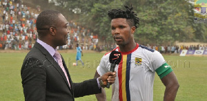 A Supersport official conducting an interview on the pitch