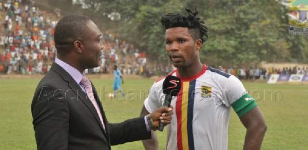 A Supersport official conducting an interview on the pitch