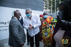 Late President Jerry John Rawlings (in white) interacting with President Akufo-Addo