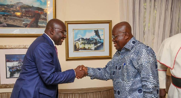 Dr. Mahamudu Bawumia (left) in a handshake with President Akufo-Addo