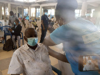 A man receiving the vaccine injection