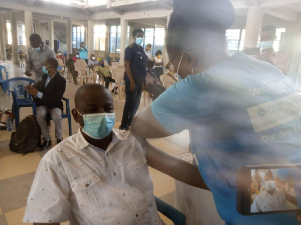 A man receiving the vaccine injection