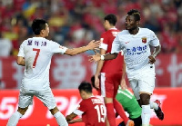 Gyan celebrates goal with teammate