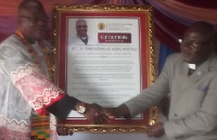 Rev. Dr. Adane Ameyaw (right) receiving the citation