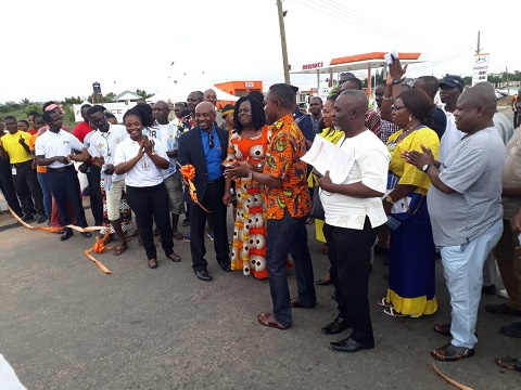 MD of RPL Emmanuel Pobee with MCE for Awutu Senya East, Michael Mensah and some community members