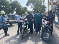 Joseph Cudjoe donating the motorbikes to the police