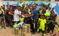 Kwasi Appiah making the donation to the football academy