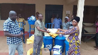 The MP hands over items for donation