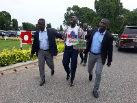 The man (middle) was whisked away by the police