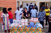 Members of LSI hand over donated items