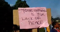 A resident holding a placard