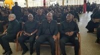 Former President J.J Rawlings (Far Left) sitting with former President John Mahama (middle)