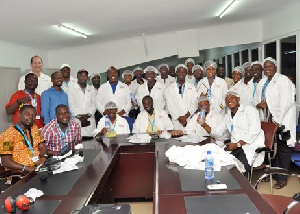 Group picture of journalist and some workers at Voltic Ghana