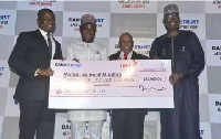 Mumuni Muqthar recieving his prize money at the event held in Nigeria