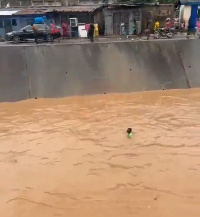 Flood washing man away