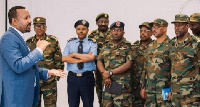 Ethiopia's Prime Minister Abiy Ahmed (in suit) addressing army officers