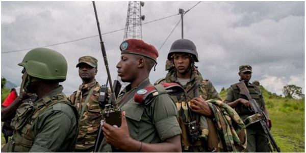 M23 rebels in Kibumba, a key highway in eastern DR Congo