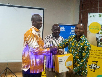 Mr Samuel Koranteng, Corporate Services Executive presenting the router to GJA