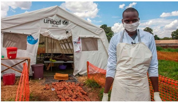 Medical worker stands in front of a ward of a Cholera Treatment Centre in Malawian capital Lilongwe