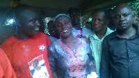 Gifty Twum-Ampofo in the middle, flanked by some supporters