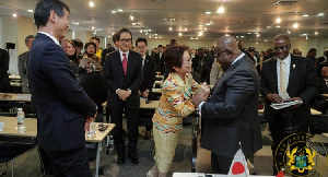 President Akufo-Addo interacting with an official at the GIPC JETRO Summit