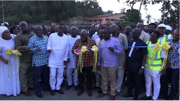 President Nana Addo Dankwa Akufo-Addo being assisted to commission the road