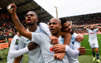 Andre Ayew celebrating with his teammates after scoring