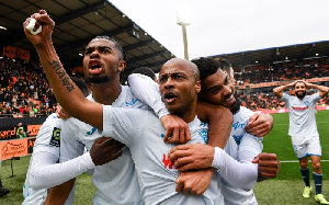 Andre Ayew celebrating with his teammates after scoring