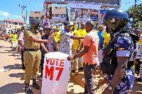 Police officers block NRM party supporters during the nomination of their candidate