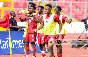 Asante Kotoko players celebrating a goal