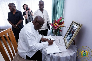 President Nana Addo Dankwa Akufo-Addo writing in the book of condolence