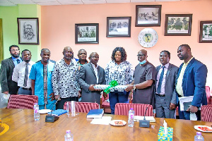 MEDA Ghana Country Director, Robert Austin (left) symbolically handing over the project to COCOBOD