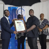 Isaac Bediako receiving the citation