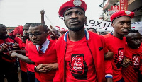 Uganda's opposition presidential candidate, Bobi Wine flanked by others