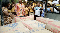 Headmistress of the school receiving the cement on behalf of the school