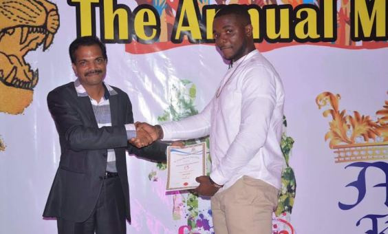 Jason Dzata receiving an award