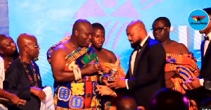 Dr. Daniel Mckorley, CEO of McDan Group receiving his award from Odeneho Kwafo Akoto III