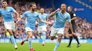 Jesus (right) as im dey celebrate di goal against Manchester City