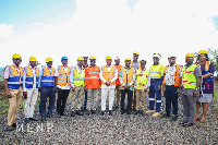 George Mireku Duker in a group photo with management of GMC and staff of the ministry