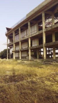 The uncompleted auditorium where the water business takes place