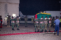 Soldiers carrying the remains of the former minister