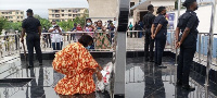 Mrs. Justina Marigold Assan laying a wreath at the ceremony