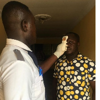 A visitor goes through a check up at the Ministry of Environment