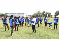 One of the coaches interacting with some of the players during the tryouts