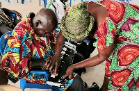 EC officials training the visually impaired on how to use the tactile jacket to vote