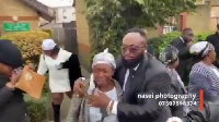 Mother of Baptista being consoled at the funeral