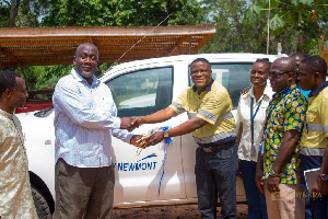 Mr. Felix Apo, Senior Manager, Sustainability(L) presenting the car key to Hon. Nana Raymond Damptey