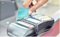 File photo: Electronic payment affords less physical contact with the recipient