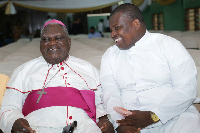 Most Rev. Peter Akwasi Sarpong with the author of the book, Rev. Fr. Derrick Eyram Senanu.