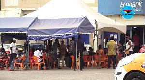 Some customers in front of one of the banks